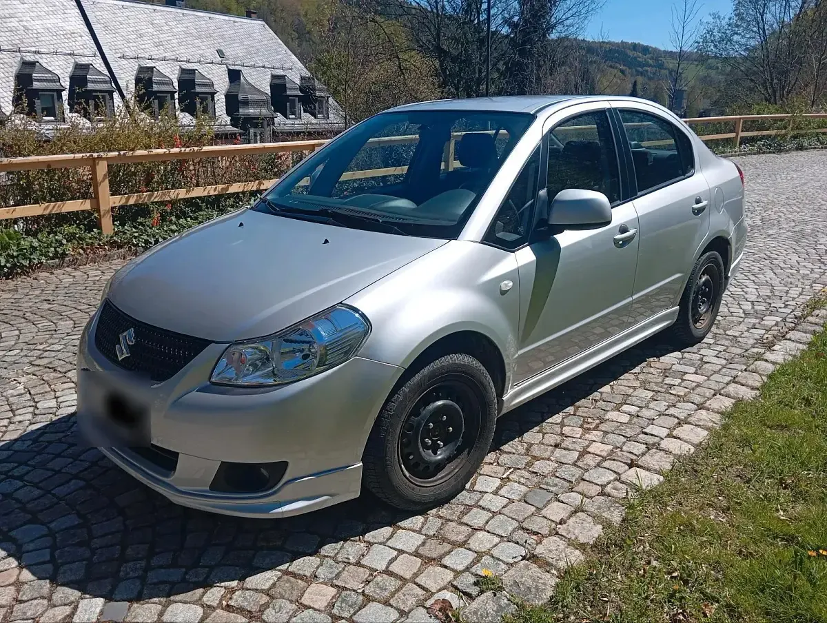 Second-hand Suzuki SX4 120 CP (88 kW) 2012 Argintiu Berlinǎ