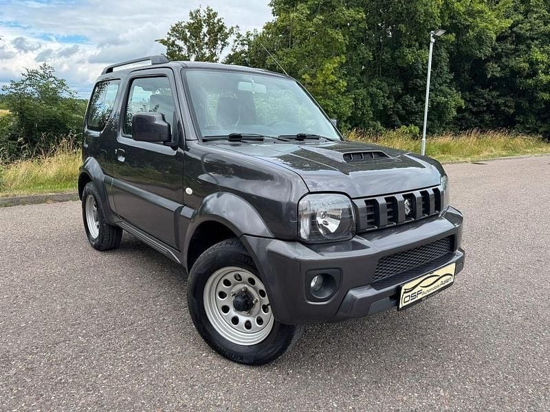 Grau Gebraucht 2015 Suzuki Jimny SUV | 9.250 € (Superpreis) - Bild 1/4