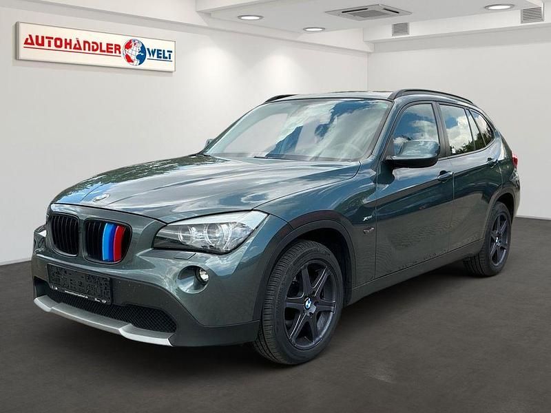 Grün Gebraucht 2010 BMW X1 Sport Line SUV | 7.499 € (Superpreis) - Bild 1/3