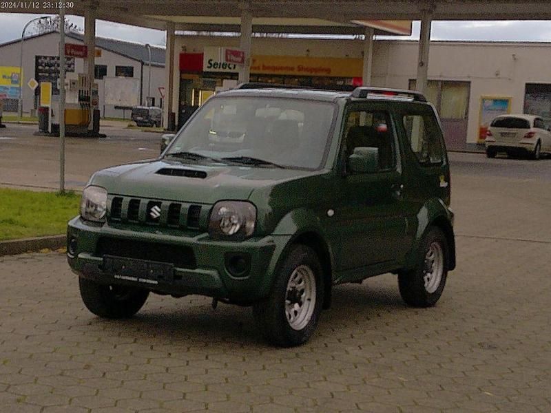 Grün Gebraucht 2013 Suzuki Jimny Ranger SUV | 11.490 € (Fairer Preis) - Bild 1/4