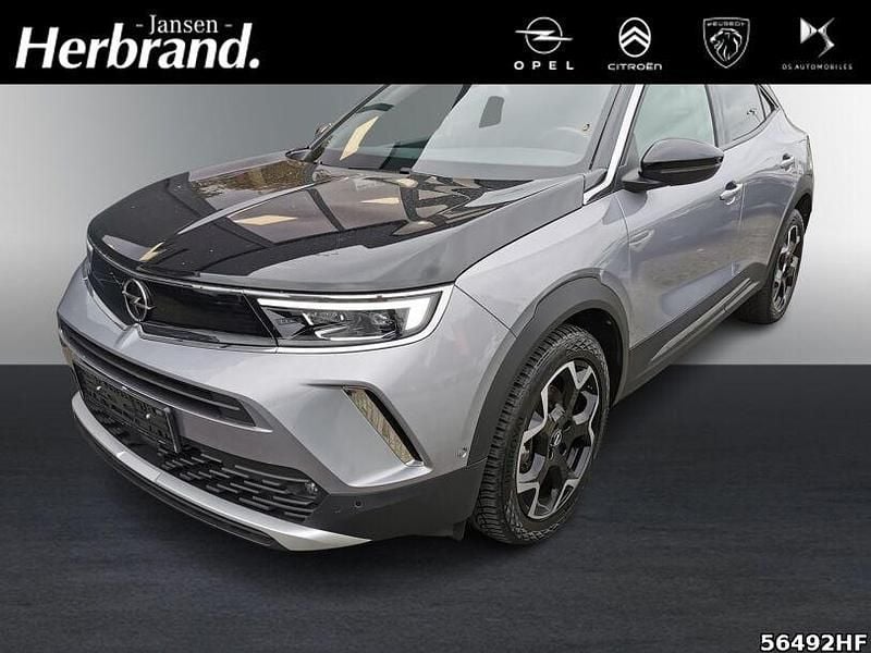 Gebraucht Opel Mokka-e Ultimate 100 kW (136 PS) 2022 Kontrast grau/quarz silber SUV
