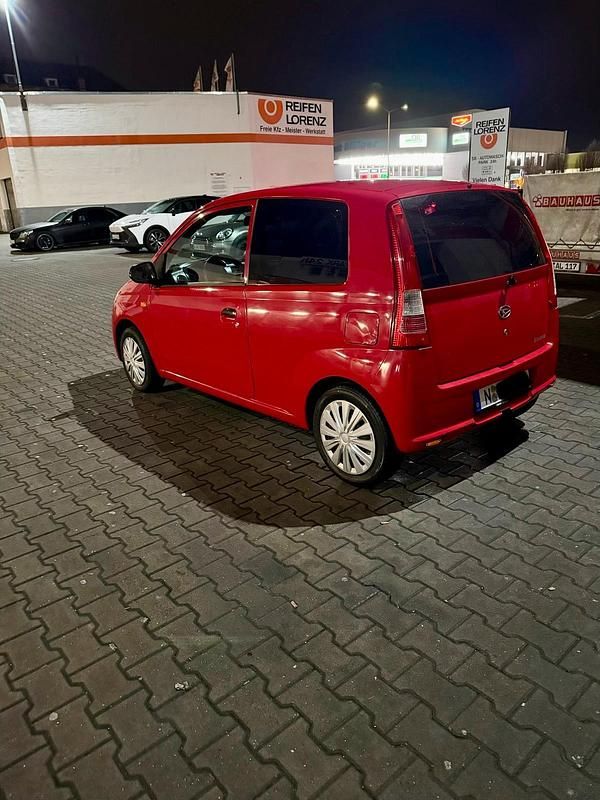 Gebraucht Daihatsu Cuore 58 PS (42 kW) 2005 Rot Kleinwagen