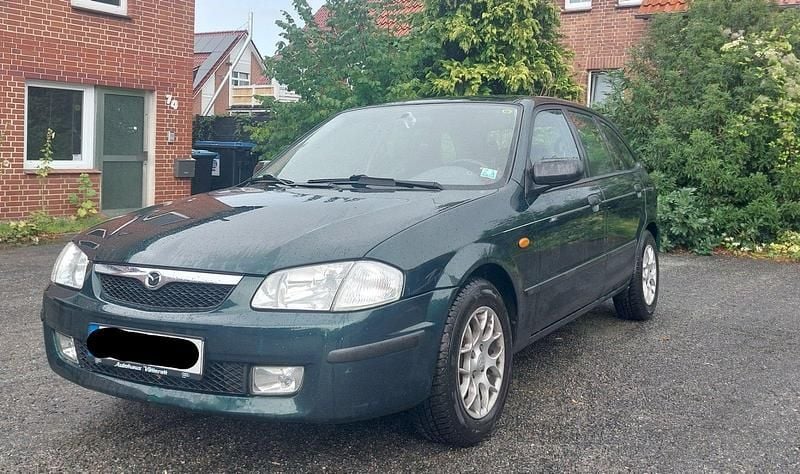 Grün Gebraucht 1998 Mazda 323 Kleinwagen | 1.111 € (Fairer Preis) - Bild 1/4