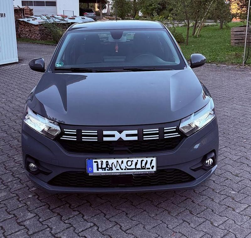 Grau Gebraucht 2023 Dacia Sandero Expression Kleinwagen | 12.900 € (Superpreis) - Bild 1/4