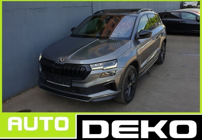 Graphitegrau metallic Gebraucht 2022 Skoda Karoq SportLine SUV | 28.370 € - Bild 1/4