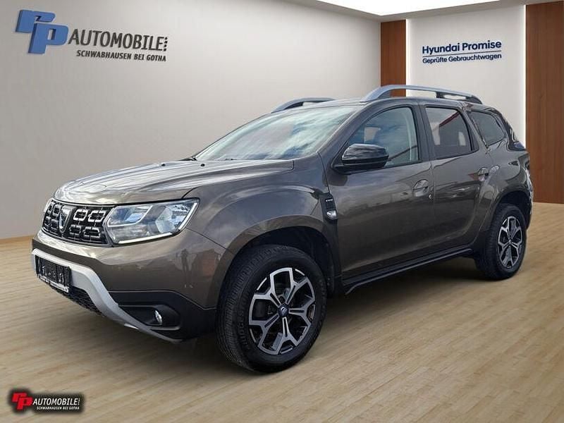 Braun Gebraucht 2021 Dacia Duster Celebration SUV | 16.990 € (Guter Preis) - Bild 1/4