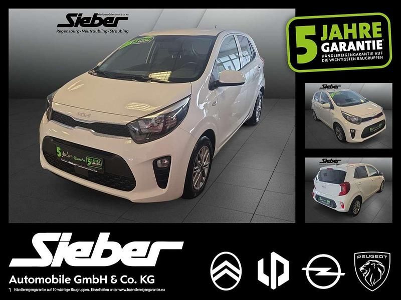 Schneeweiss Gebraucht 2021 Kia Picanto DREAM-TEAM Edition Kleinwagen | 11.990 € (Fairer Preis) - Bild 1/4