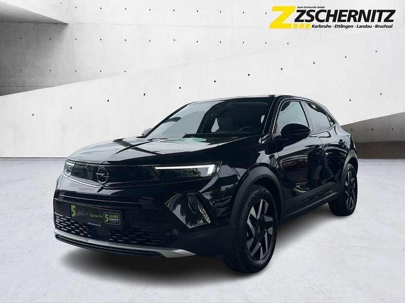 Gebraucht Opel Mokka-e Elegance 100 kW (136 PS) 2023 Lackierung schwarz perla nera/ SUV
