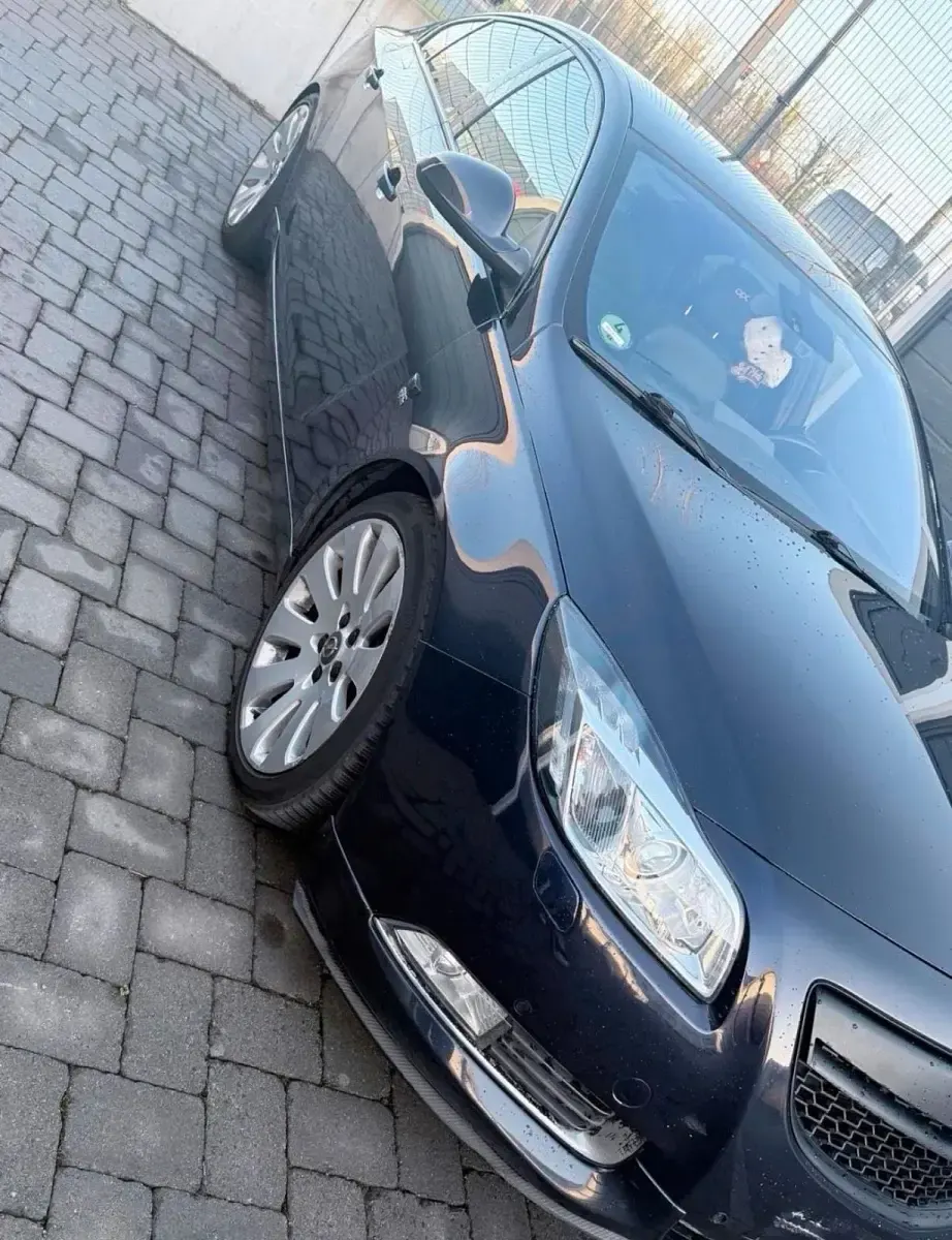 Używany Opel Insignia 200 KM (147 kW) 2012 Purpurowy Sedan/Limuzyna
