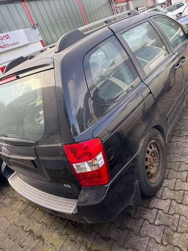 Gebraucht Kia Carnival LX 185 PS (136 kW) 2010 Midnight black Van / Kleinbus