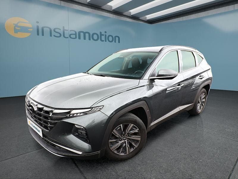 Grau Gebraucht 2021 Hyundai Tucson SUV | 22.299 € (Fairer Preis) - Bild 1/4