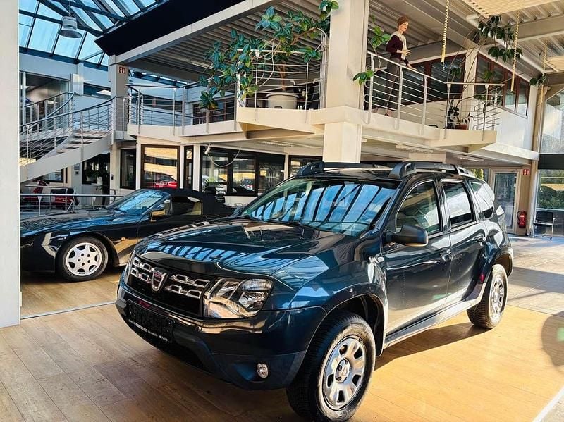 Grau Gebraucht 2015 Dacia Duster Basis SUV | 8.175 € (Fairer Preis) - Bild 1/4