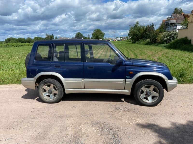 Blau Gebraucht 1995 Suzuki Vitara SUV | 2.799 € - Bild 1/4