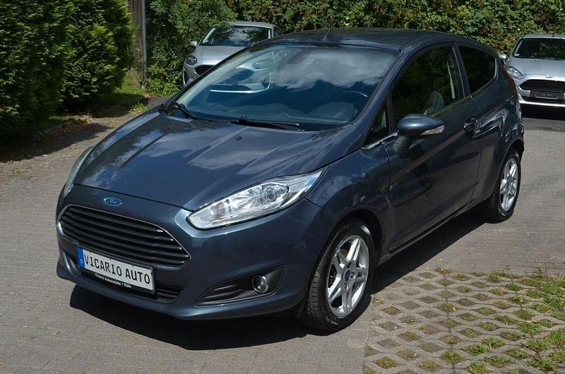 Grau Gebraucht 2014 Ford Fiesta Kleinwagen | 2.999 € - Bild 1/4