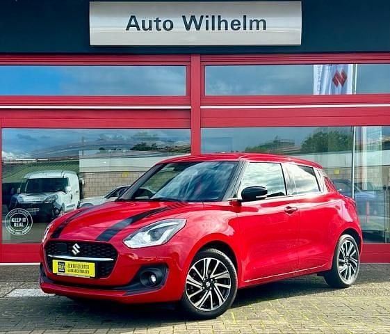 Solid fervent red Gebraucht 2021 Suzuki Swift Comfort+ Limousine | 13.990 € (Fairer Preis) - Bild 1/4
