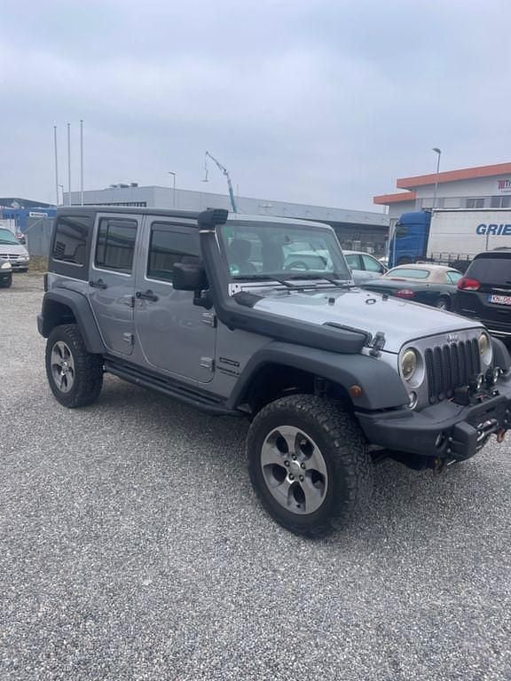 Grau Gebraucht 2014 Jeep Wrangler Unlimited Sport SUV | 25.900 € (Fairer Preis) - Bild 1/4