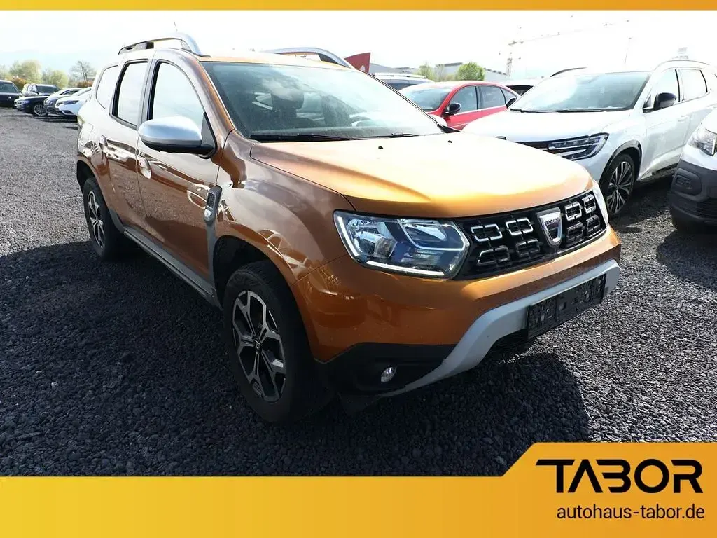 Używany Dacia Duster Prestige 101 KM (74 kW) 2021 Pomarańczowy SUV