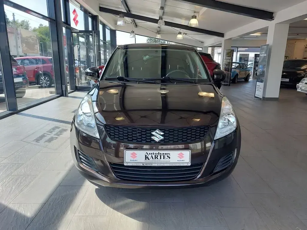 Gebraucht Suzuki Swift X-TRA 94 PS (69 kW) 2012 Braun Kleinwagen