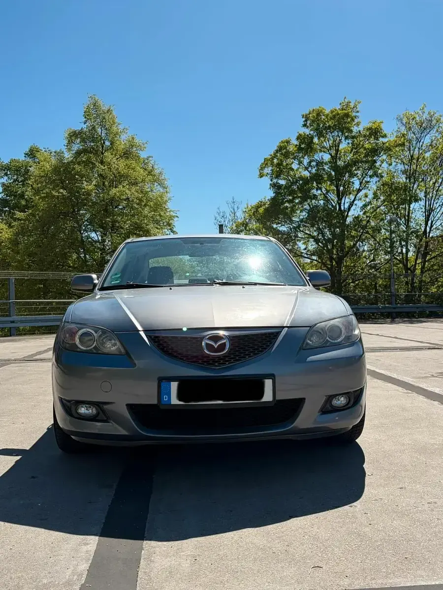 Używany Mazda 3 105 KM (77 kW) 2007 Szary Sedan/Limuzyna