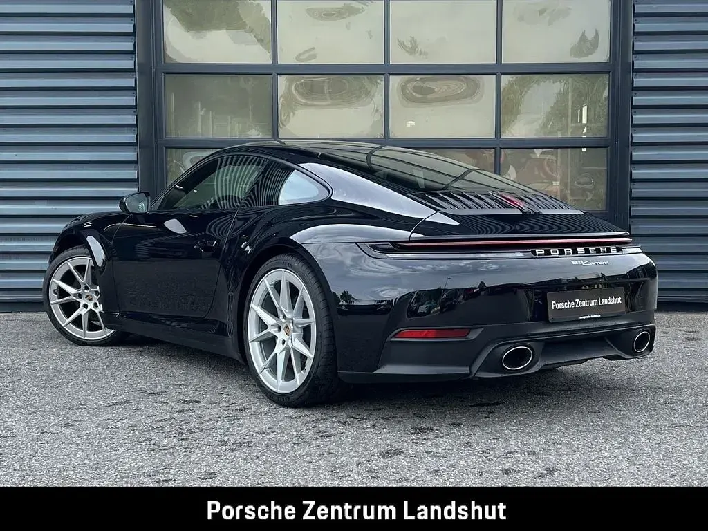 Gebraucht Porsche 911 Carrera 394 PS (289 kW) 2025 Tiefschwarzmetallic Coupé