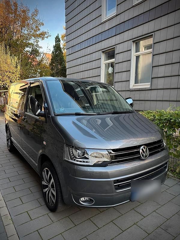 Grau Gebraucht 2015 VW Multivan Van | 26.900 € (Superpreis) - Bild 1/4