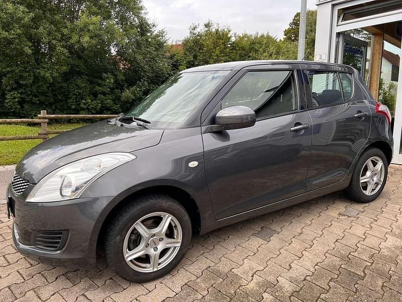 Grau Gebraucht 2013 Suzuki Swift Club Kleinwagen | 8.900 € (Teuer) - Bild 1/4