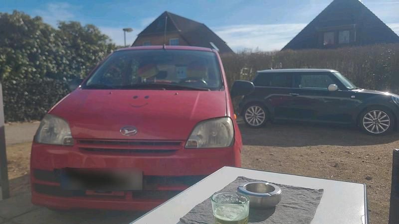 Gebraucht Daihatsu Cuore 58 PS (42 kW) 2006 Rot Kleinwagen