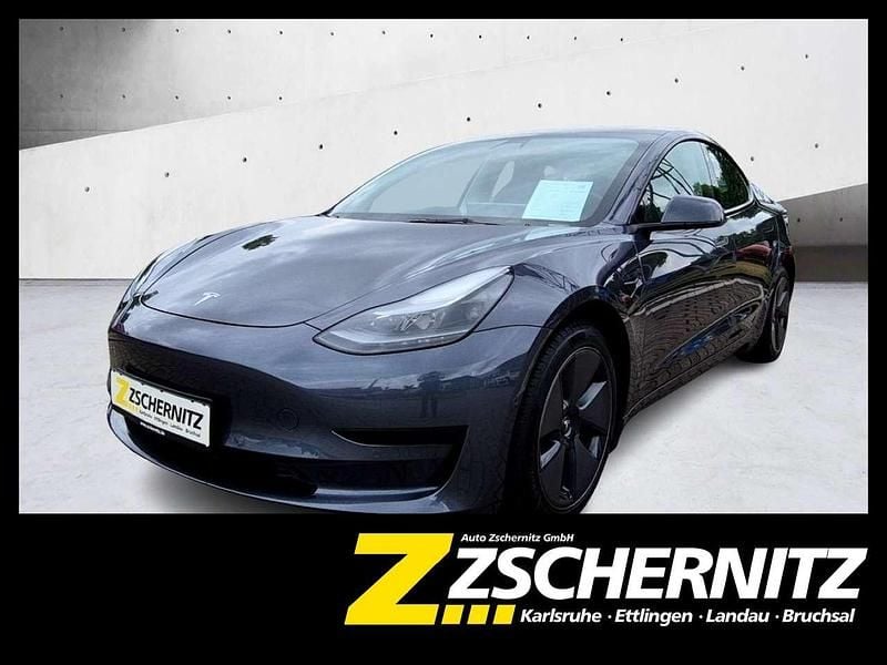 Grau Gebraucht 2021 Tesla Model 3 Standard Range Plus Limousine | 23.990 € (Guter Preis) - Bild 1/4