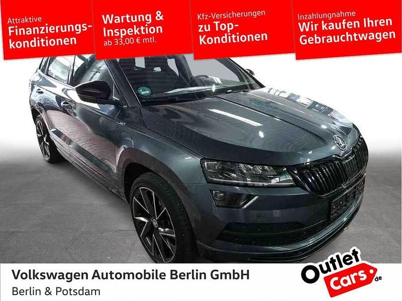 Grau Gebraucht 2021 Skoda Karoq SportLine SUV | 29.740 € (Guter Preis) - Bild 1/3