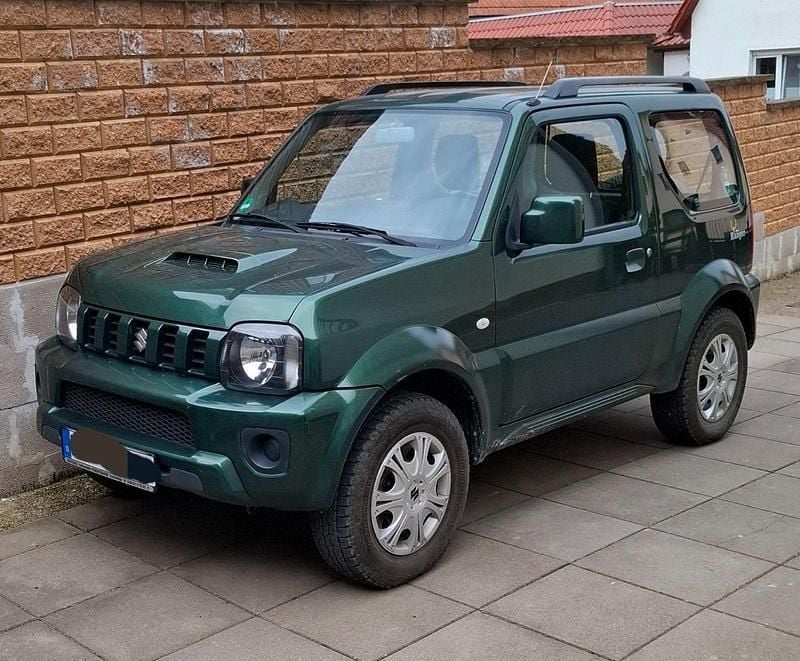 Grün Gebraucht 2013 Suzuki Jimny Club SUV | 11.500 € (Superpreis) - Bild 1/4