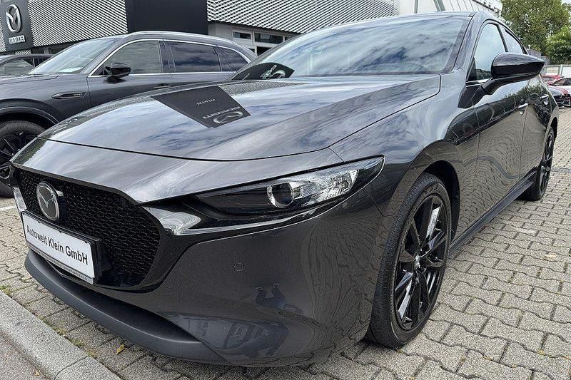 Machine gray Gebraucht 2024 Mazda 3 Homura-Line Limousine | 26.900 € (Fairer Preis) - Bild 1/4