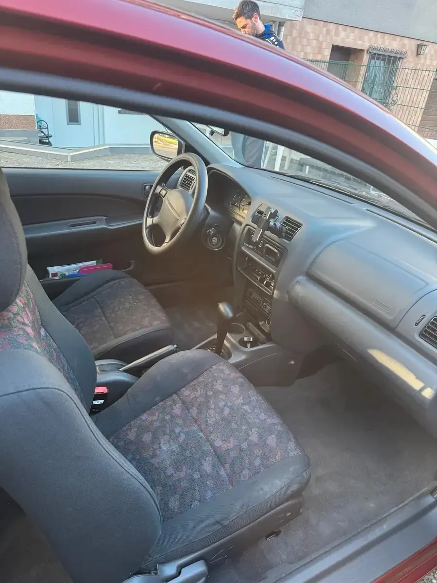 Gebraucht Mazda 323 88 PS (64 kW) 1997 Rot Kleinwagen