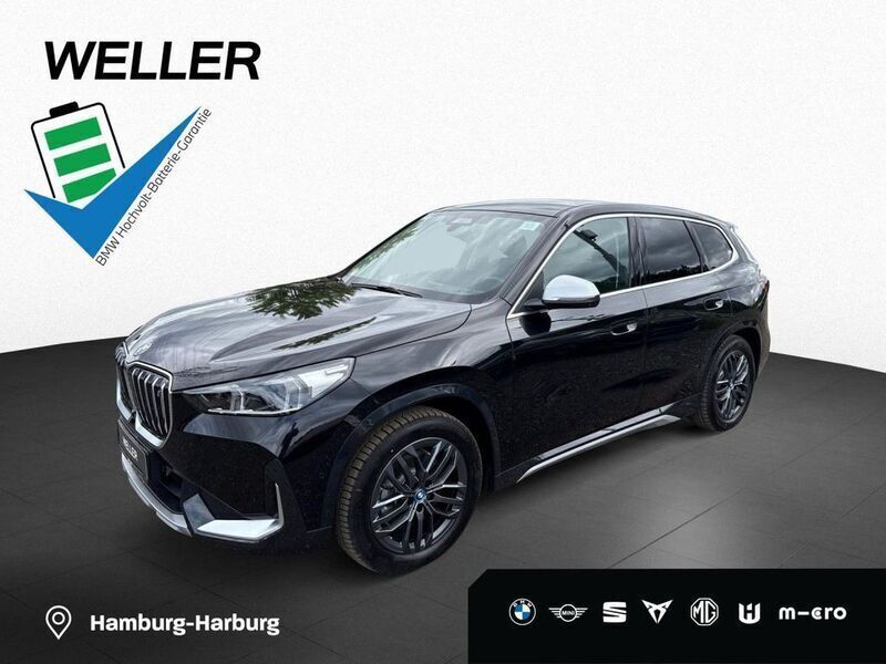 Black sapphire (schwarz) Gebraucht 2023 BMW iX1 Comfort Edition SUV | 41.980 € (Guter Preis) - Bild 1/3
