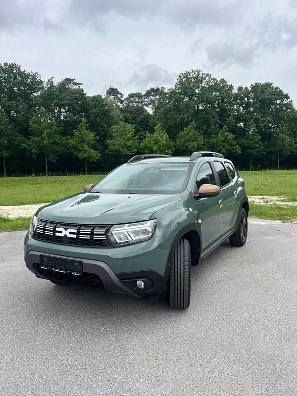 Grün Gebraucht 2024 Dacia Duster Extreme SUV | 23.200 € - Bild 1/4