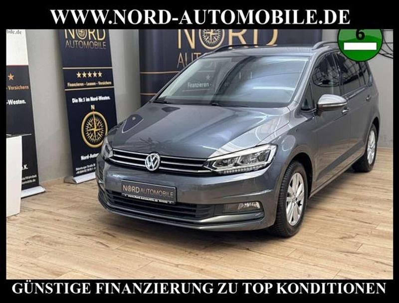 Indiumgrau metallic (metallic) Gebraucht 2021 VW Touran Comfortline Van / Kleinbus | 22.490 € (Guter Preis) - Bild 1/3