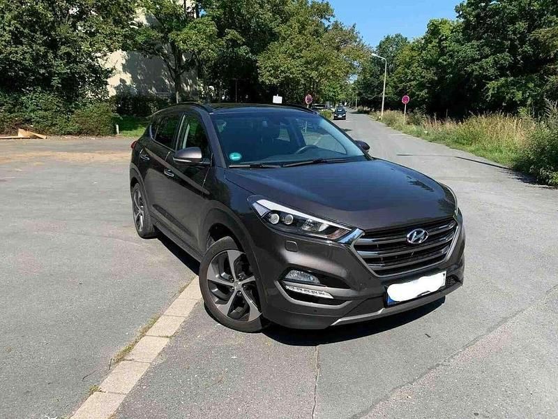 Braun Gebraucht 2016 Hyundai Tucson Premium SUV | 15.700 € (Superpreis) - Bild 1/4
