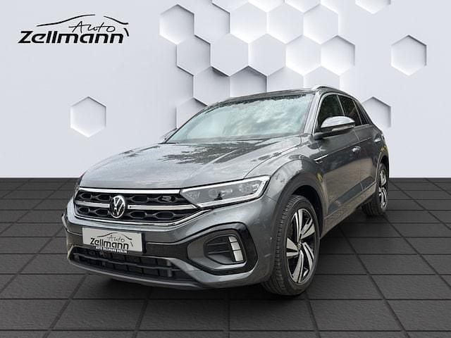 Indiumgrau Gebraucht 2024 VW T-Roc R-line SUV | 29.968 € (Fairer Preis) - Bild 1/3
