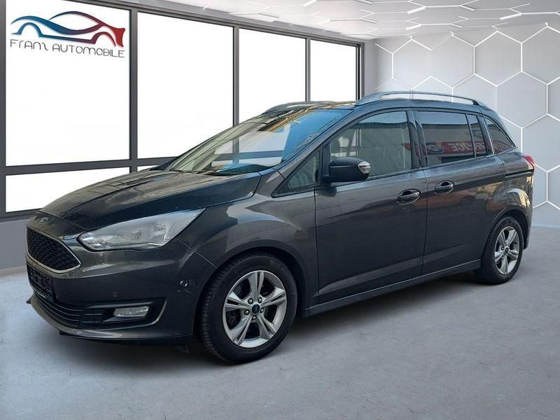 Grau Gebraucht 2016 Ford Grand C-Max Business Edition Van / Kleinbus | 9.985 € (Fairer Preis) - Bild 1/4