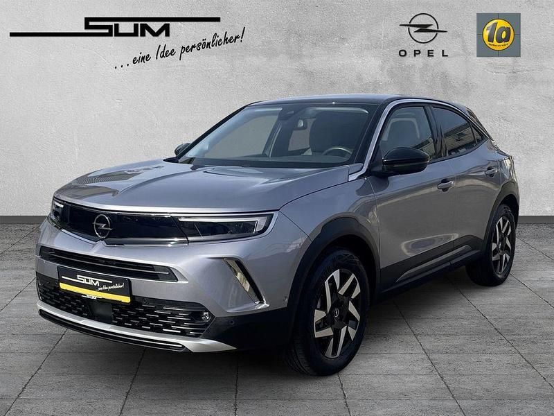 Gebraucht Opel Mokka-e Elegance 100 kW (136 PS) 2023 Kontrast grau/quarz silber SUV