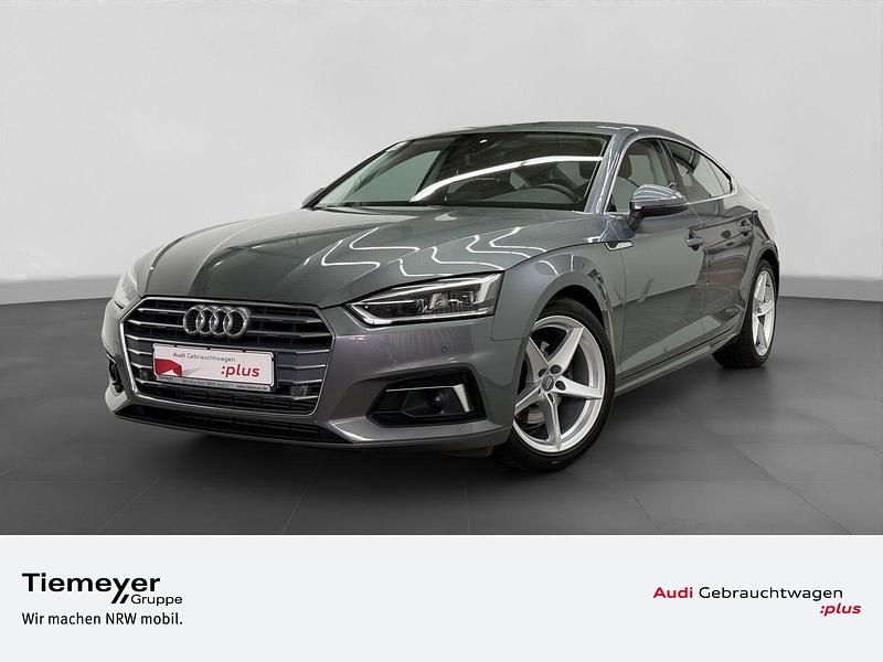 Monsungrau metallic Gebraucht 2019 Audi A5 Sportback Sport Limousine | 26.960 € (Superpreis) - Bild 1/4