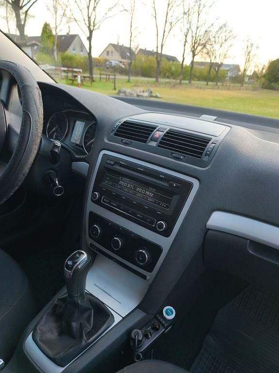 Second-hand Skoda Octavia Impuls Edition 105 CP (77 kW) 2011 Negru Break