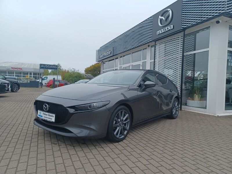 Machine gray Gebraucht 2021 Mazda 3 Selection Limousine | 19.990 € (Fairer Preis) - Bild 1/4