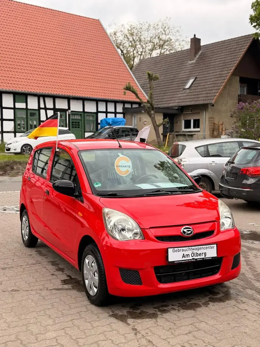 Gebraucht Daihatsu Cuore 69 PS (50 kW) 2010 Rot Kleinwagen