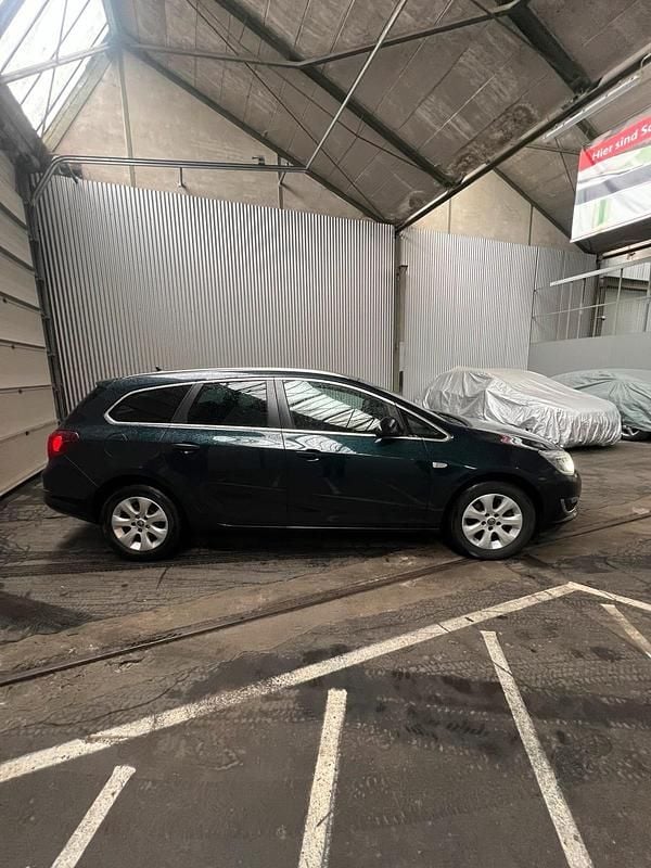 Gebraucht Opel Astra 110 PS (80 kW) 2016 Grün Kombi