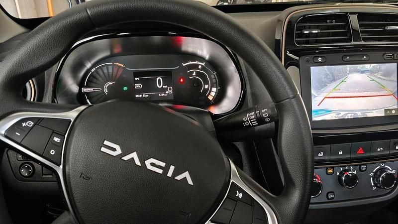 Gebraucht Dacia Spring Extreme 47 kW (65 PS) 2023 Weiß Kleinwagen