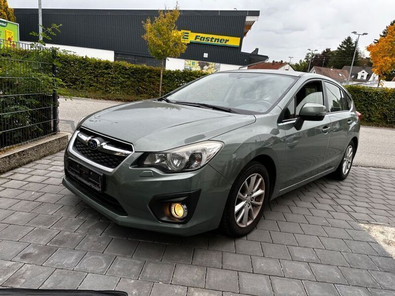 Grün Gebraucht 2013 Subaru Impreza Comfort Limousine | 5.799 € - Bild 1/4