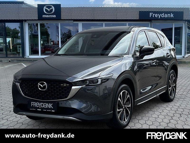 Machine grey Gebraucht 2024 Mazda CX-5 Newground SUV | 38.490 € (Fairer Preis) - Bild 1/4