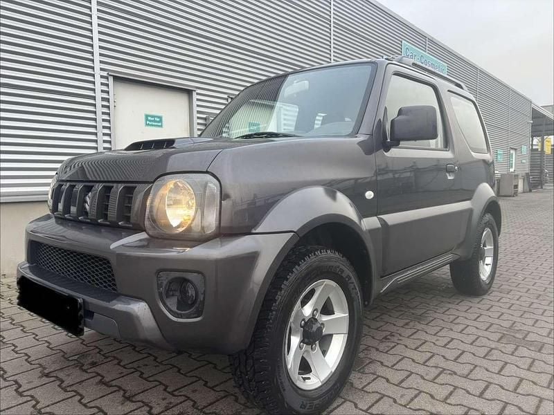 Grau Gebraucht 2014 Suzuki Jimny Style SUV | 13.380 € (Fairer Preis) - Bild 1/4