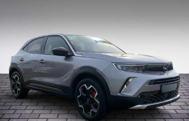 Grau metallic Gebraucht 2021 Opel Mokka-e Ultimate SUV | 27.200 € - Bild 1/4