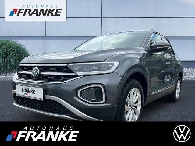 Grau Gebraucht 2023 VW T-Roc Style SUV | 30.819 € (Fairer Preis) - Bild 1/4